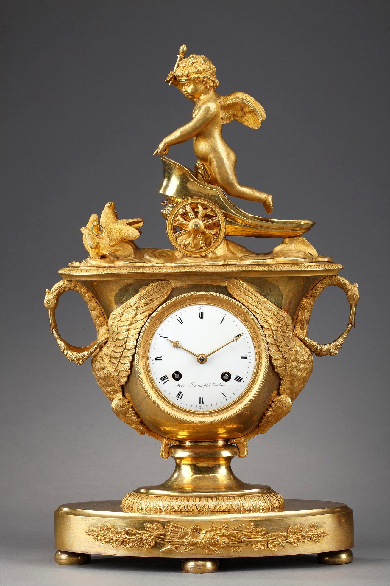 Empire clock with putto on a chariot